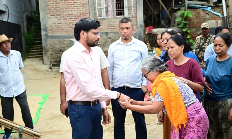 Manipur district official distributes relief in flood-hit Churachandpur areas
